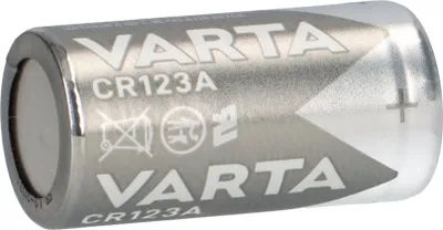 A close-up studio shot of a VARTA CR123A lithium battery.