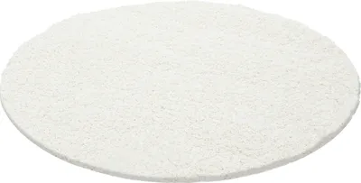 A round, cream-colored rug is shown from a slightly elevated angle against a white background.
