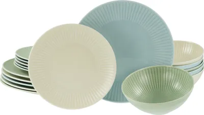 A collection of pastel-colored ceramic plates and bowls arranged on a white background.