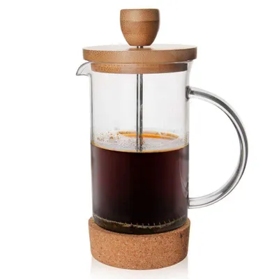 A French press coffee maker filled with coffee.