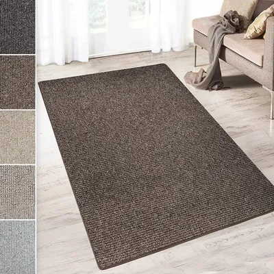 A brown rug is shown in a living room setting with a sofa and a blanket.