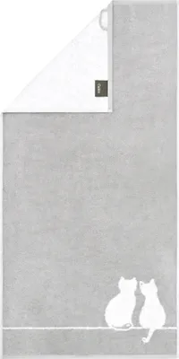 A gray towel with a white cat design.