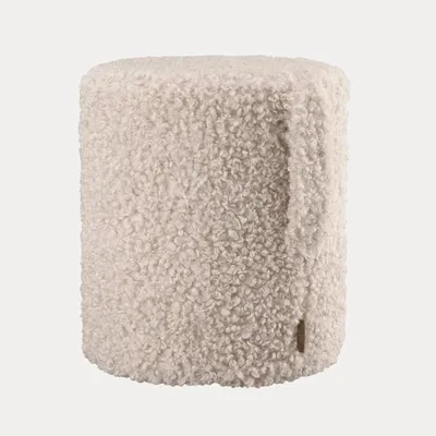 A fluffy, cylindrical ottoman or stool.