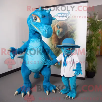 Obrázok produktu pre Kostýmová postava azurovo modrého maskota Utahraptora, oblečená do obleku a s čelenkou