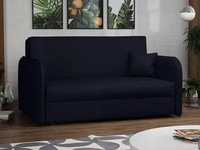 A dark blue sofa with a single throw pillow is shown in a living room setting, with artwork on the wall and a coffee table in the foreground.