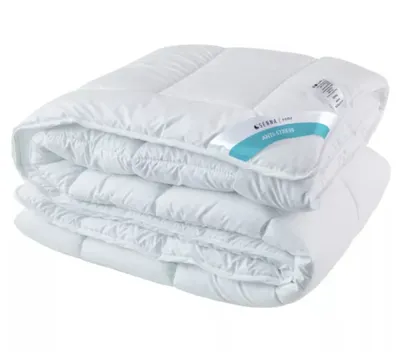 A folded white duvet is shown against a white background.