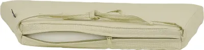 A close-up, side view of a beige cushion with a zipper partially open, revealing the white foam interior.
