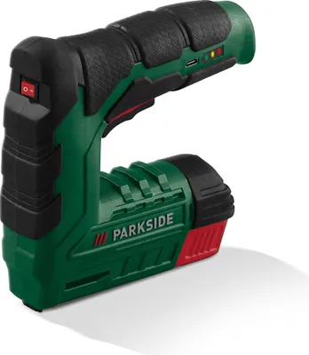 A studio shot of a cordless tacker on a white background.