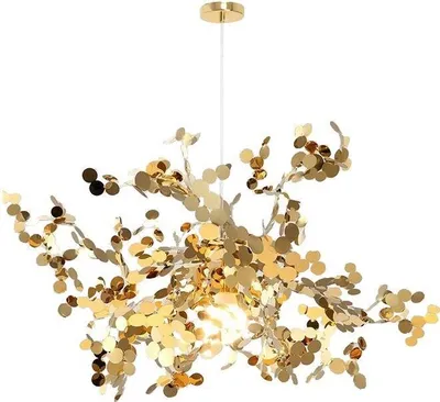 A gold chandelier with many small, circular, reflective elements resembling leaves or petals, hanging from a white cord against a white background.