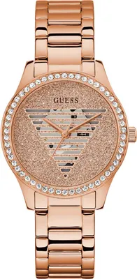 A close-up studio shot of a rose gold Guess watch.
