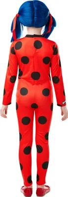 A child wearing a ladybug costume, viewed from the back.