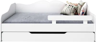 A white daybed with a pull-out trundle, shown with decorative pillows.