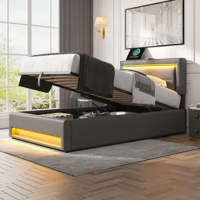 A modern bedroom with a grey upholstered bed frame, featuring a lift-up mattress for storage and integrated LED lighting.