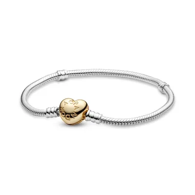 A silver Pandora bracelet with a gold heart-shaped clasp.