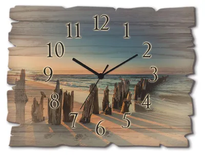 A wall clock with a beach sunset scene, showing wooden posts and waves.