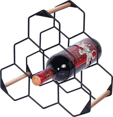 A black metal wine rack with a bottle of red wine inside, set against a white background.