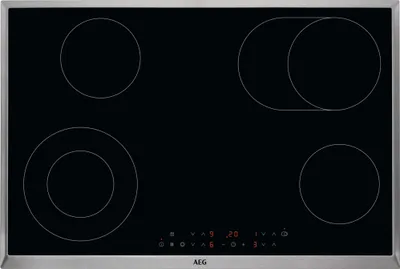 A top-down view of a black glass ceramic hob with four cooking zones and a control panel at the bottom.