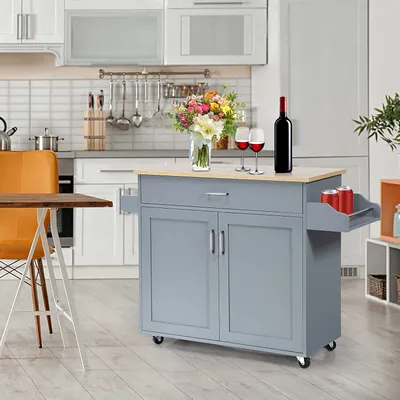 A kitchen island cart in a kitchen setting.
