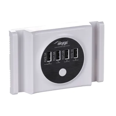 A white multi-port USB charger with a black circular insert displaying ports and branding.