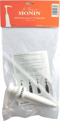 The image shows a Monin syrup pump packaged in its original retail packaging, which includes a cardboard header and a clear plastic bag. The header displays the brand logo and product information.