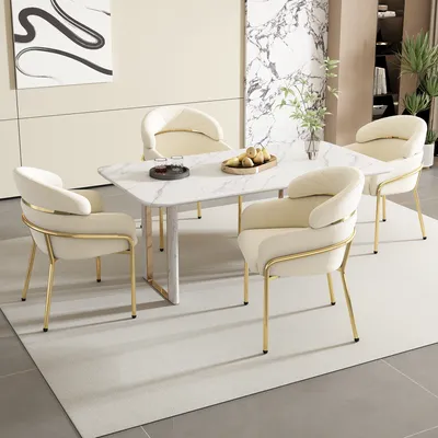 A dining set with a marble-top table and four beige upholstered chairs with gold legs, placed on a light gray rug.