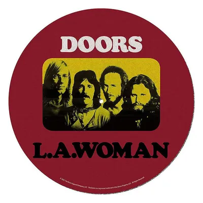 A circular record mat with the band The Doors and album title L.A. Woman printed on it.