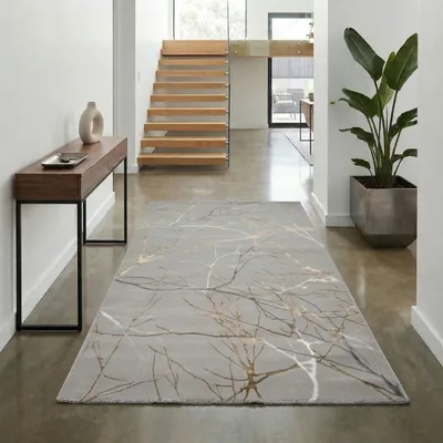 Produktbild von Designer Teppich mit abstraktem glänzenden Ästemuster gold Größe - 60 x 110 cm