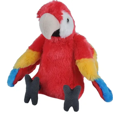 A plush toy parrot sits on a white background.