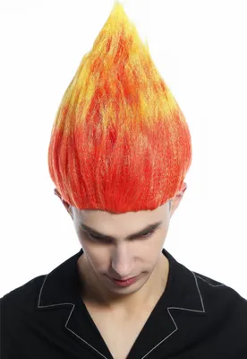 A man wearing a black shirt with a white collar is shown from the chest up, wearing a flame-shaped wig.