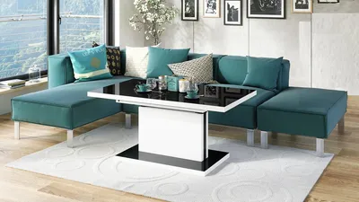 A modern living room with a sectional sofa and a coffee table.