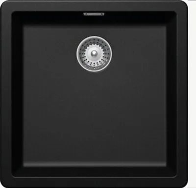 A top-down view of a black kitchen sink with a silver drain.