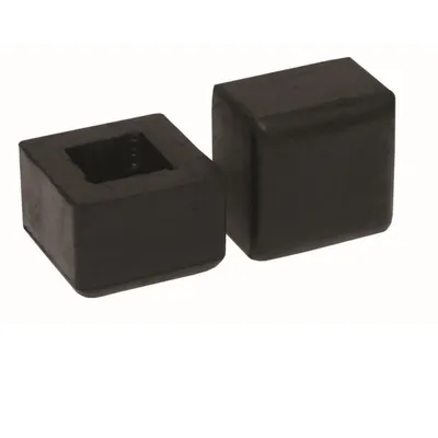 Two black rubber cube-shaped objects on a white background. One object has a square indentation in the top surface.
