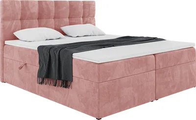 A pink upholstered box spring bed with a headboard, mattress, and topper, shown against a white background.