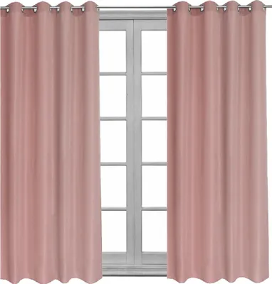 Two pink curtains are hanging on a window.