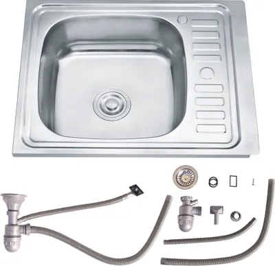 A stainless steel kitchen sink and its plumbing accessories are displayed against a white background.