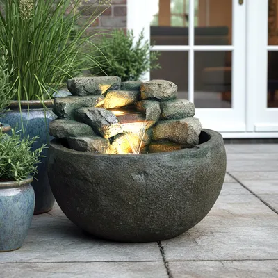 Produktbild von Gartenbrunnen BK911 Ø50 cm – Runder Springbrunnen in Steinoptik mit Wasserfall, warmweiße LED Beleuchtung Deko Teich