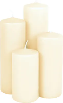 Four pillar candles of varying heights are arranged together against a white background.