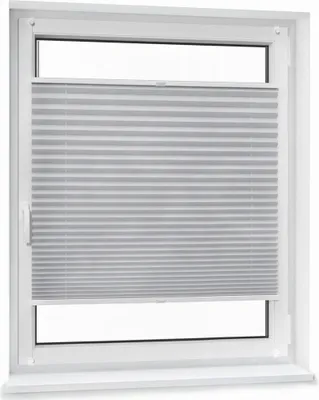 A white framed window with a gray pleated blind covering most of the glass.