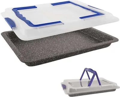 A baking tray with a transparent lid and blue handles, shown from a slightly elevated angle. A smaller inset image shows the lid with its handles in an upright position.