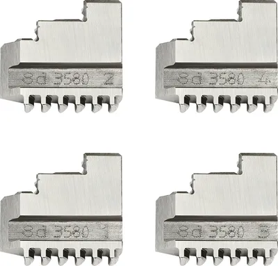 Four metal chuck jaws are arranged in a grid on a white background.