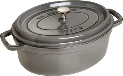 A close-up studio shot of a gray oval cast iron pot with a lid.
