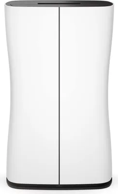 A product shot of a white dehumidifier with a black base and top.