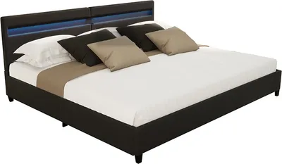 A modern black bed with blue LED lighting in the headboard, shown with pillows and bedding.