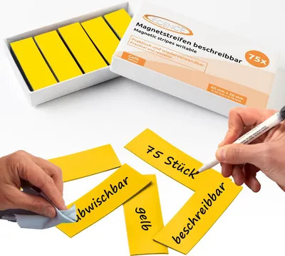 A product shot showing a box of magnetic strips and some individual strips being written on and cleaned.