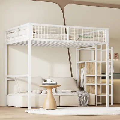 A loft bed with a sofa underneath, a small table, and a shelving unit with clothes. The scene is set in a modern bedroom.