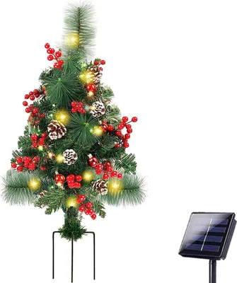 A decorated artificial Christmas tree with lights, berries, and pinecones, along with a separate solar panel.