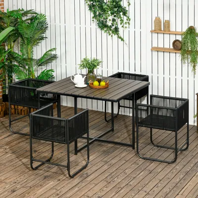 An outdoor patio set with a table and four chairs, set up on a wooden deck.