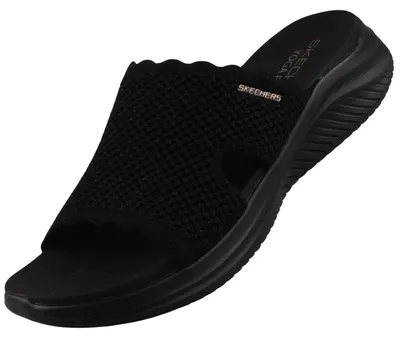 Auf dem Bild ist ein flacher Schuh in der Farbe Schwarz abgebildet. Der Schuh ist von der linken Seite zu sehen und zeigt eine schlichte und elegante Form.