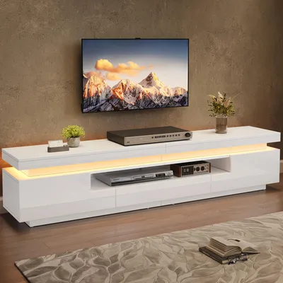 A modern living room with a TV stand and a mounted television.