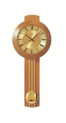 A wooden pendulum clock with a gold-colored face and pendulum, isolated on a white background.